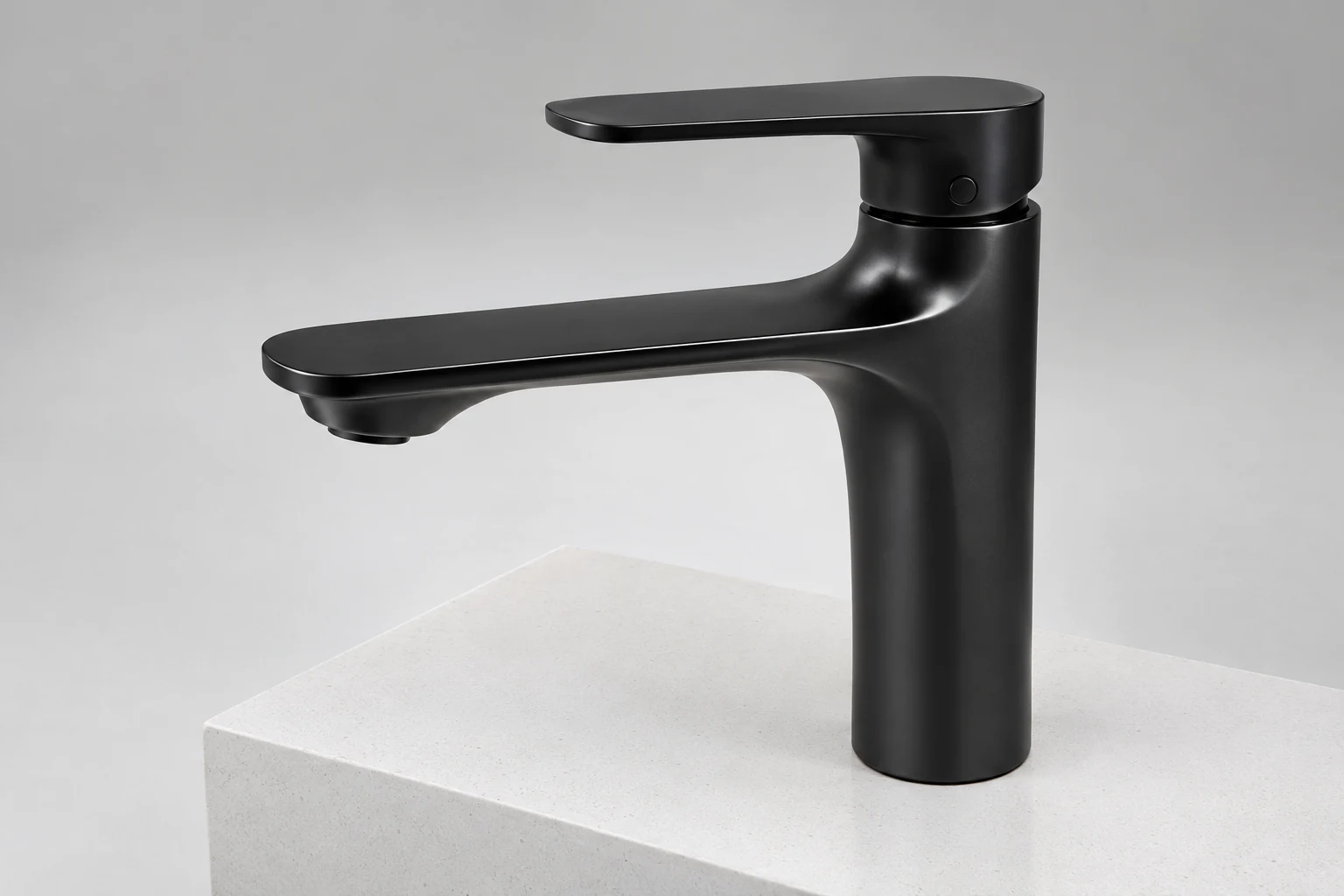 Matte black single-handle faucet on a light stone countertop